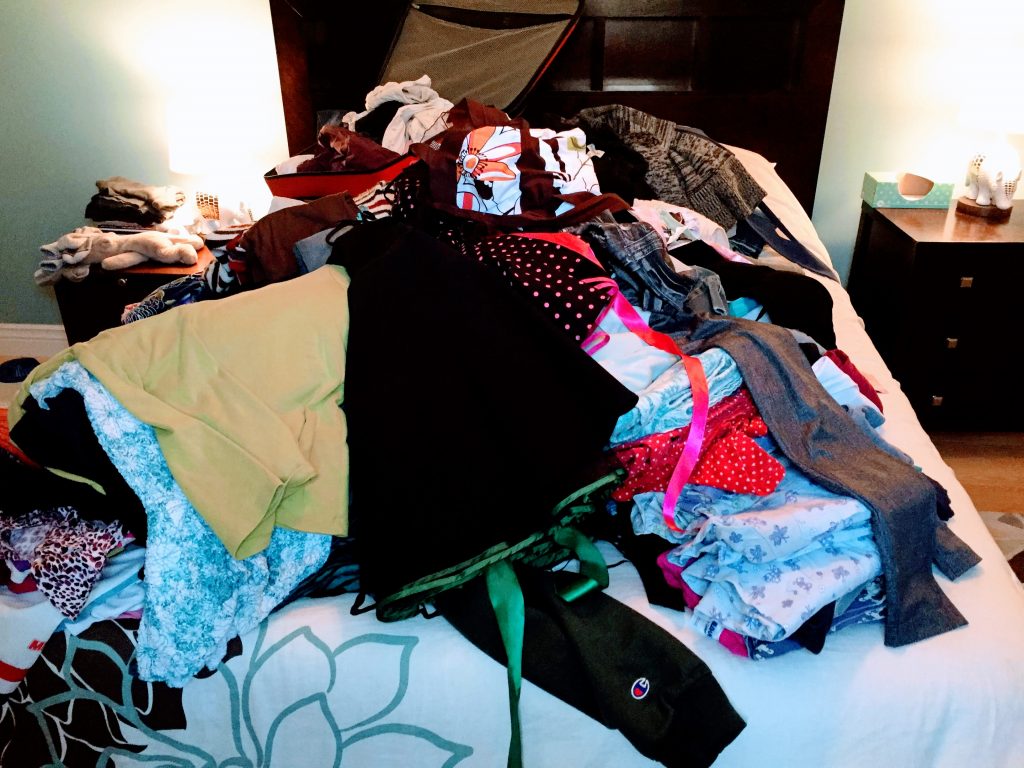 Pile of clothes on my bed ready to joy check